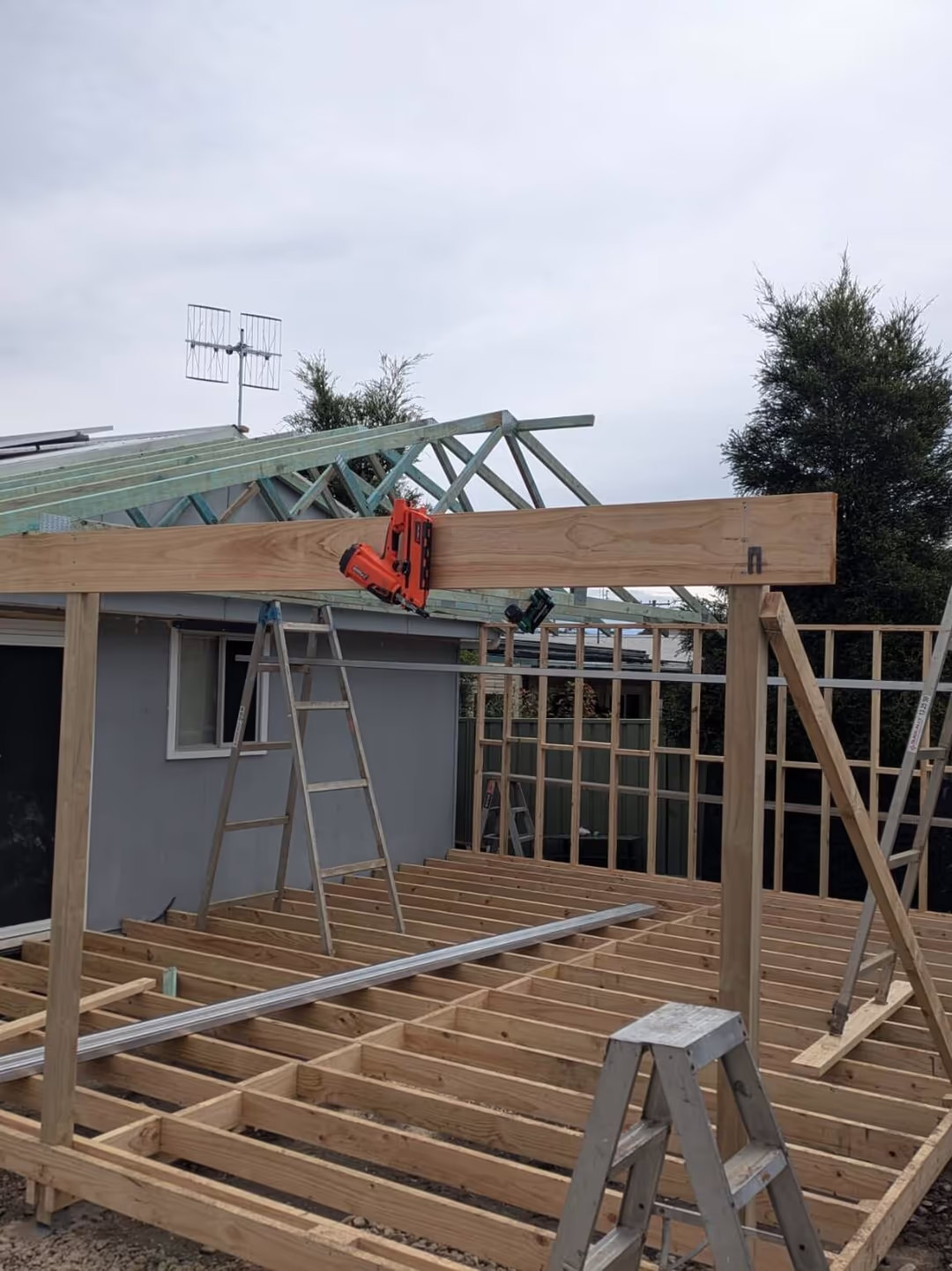 Deck frame and roof trusses going up